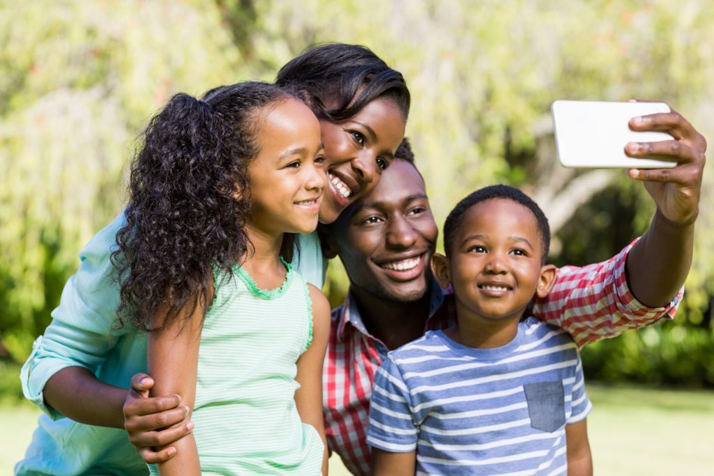 Black family with Husband, Wife, and two children.