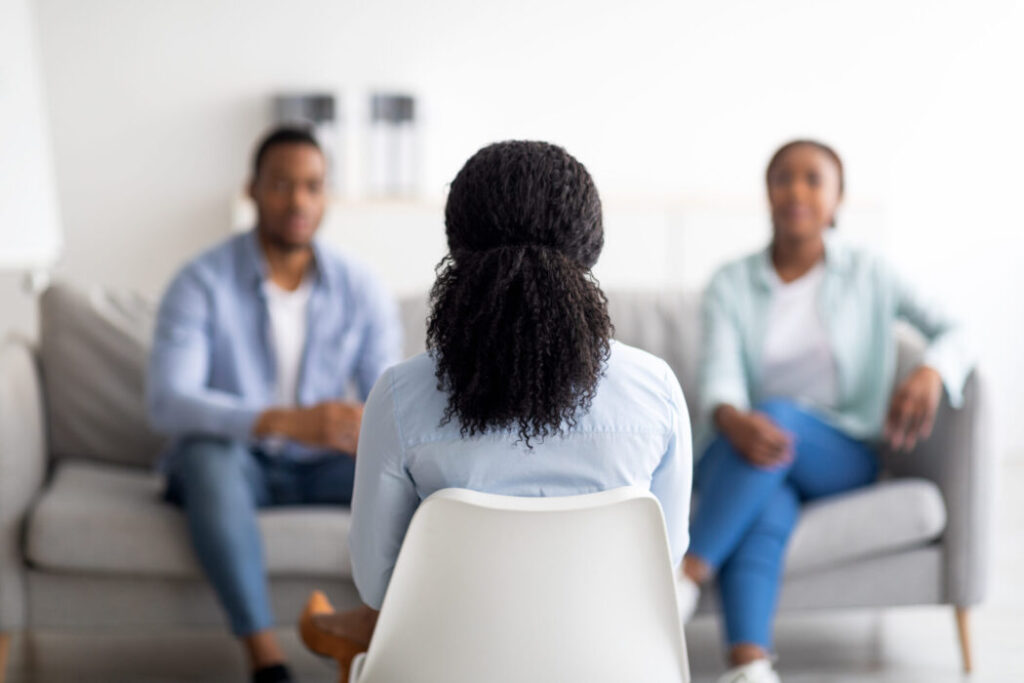 Black Couple receiving Therapy from a black female therapist